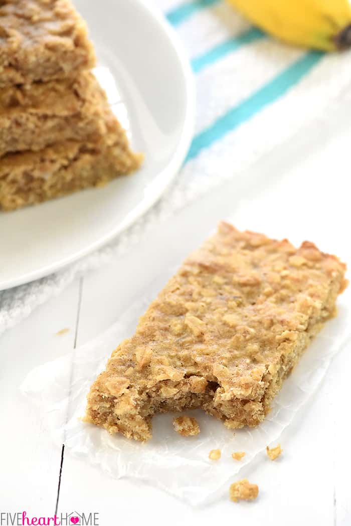Soft-Baked Banana Oatmeal Bars ~ loaded with wholesome ingredients for a yummy, portable breakfast or snack! | FiveHeartHome.com Oatmeal Bar on table with missing bite