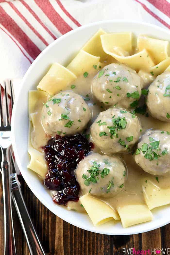 Swedish Meatballs ~ baked in the oven and then simmered in a skillet of creamy homemade gravy, this family-pleasing dinner recipe is both easy and delicious! | FiveHeartHome.com