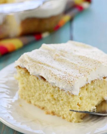 Tres Leches Cake ~ soaked with three types of milk and topped with fresh whipped cream, this sweet, moist, decadent dessert is perfect for celebrating Cinco de Mayo! | FiveHeartHome.com