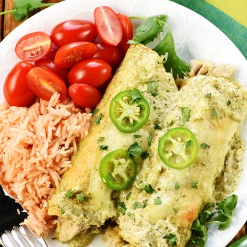 Creamy Jalapeño Chicken Enchiladas on plate.