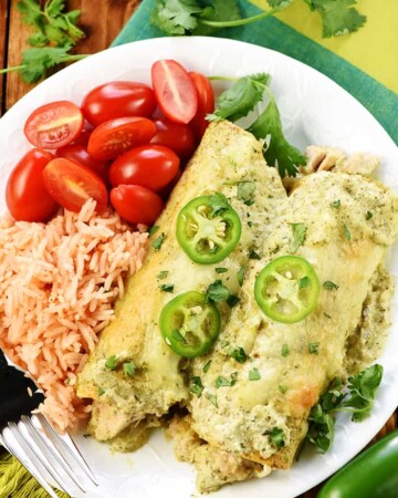 Creamy Jalapeño Chicken Enchiladas on plate.