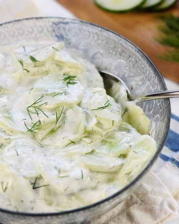 Creamy German Cucumber Salad, AKA Gurkensalat ~ a fresh and simple side dish featuring thinly sliced cucumbers in a sour cream and dill dressing! | FiveHeartHome.com