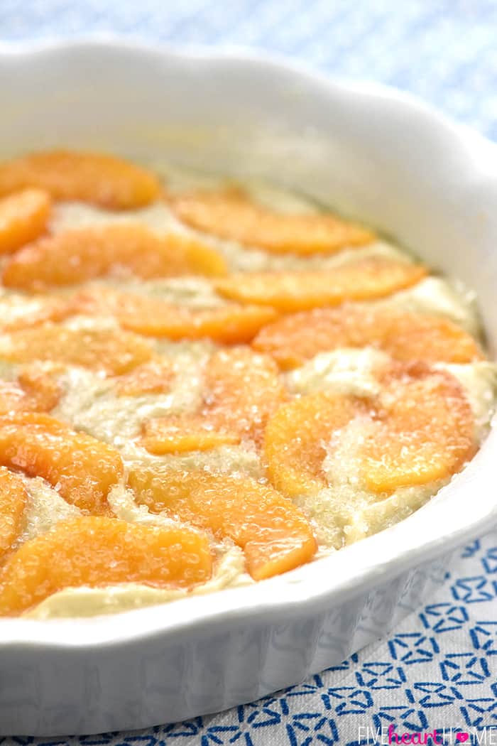 Close-up of batter and fruit in baking dish, ready for oven.