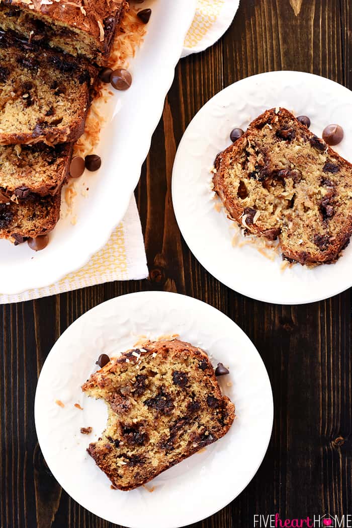 Aerial view of sliced loaf with pieces of banana bread on two white plates