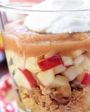 Healthy Apple Pie Snack Cups ~ layers of graham cracker crumbs, diced apples, cinnamon applesauce, and whipped cream make a wholesome after-school snack or dessert that tastes just like apple pie! | FiveHeartHome.com