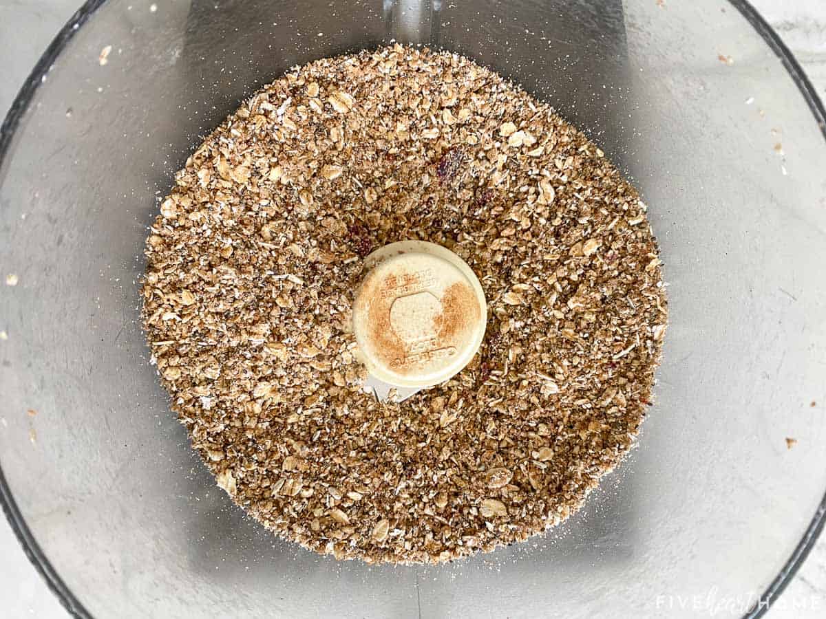 Aerial view of oats added to food processor.