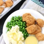 Aerial view of Homemade Chicken Nuggets on a plate with sides.