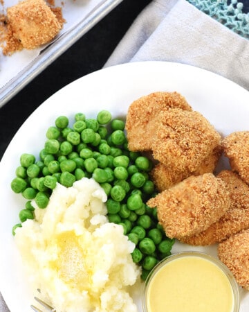 Aerial view of Homemade Chicken Nuggets on a plate with sides.