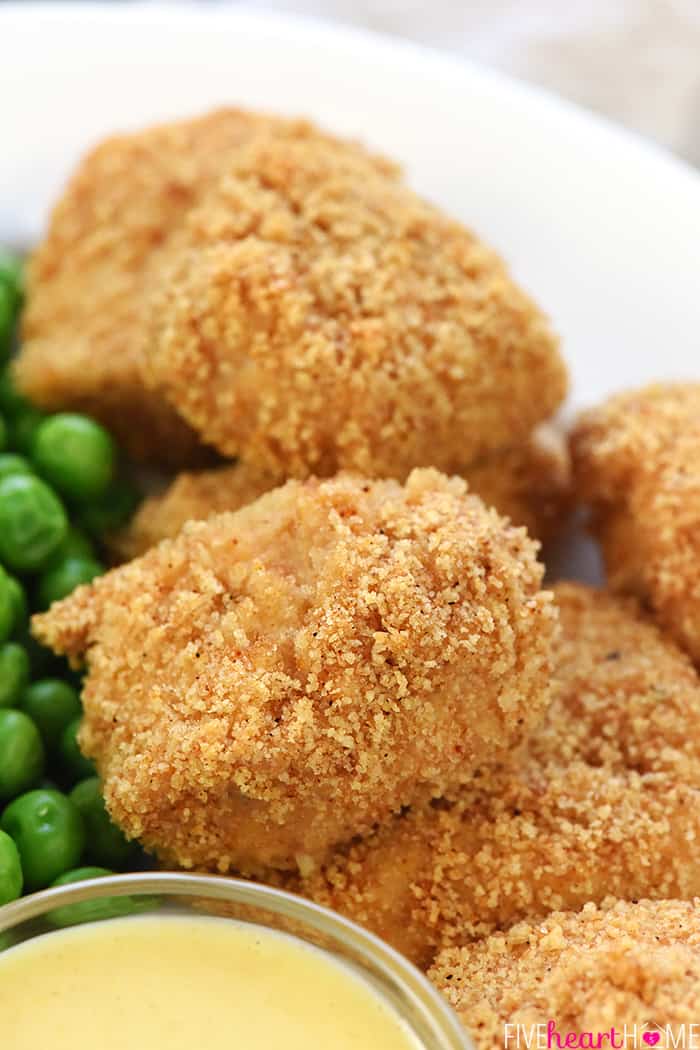 Homemade Chicken Nuggets ~ this recipe is made the QUICK AND EASY way, with a copycat "shake n bake" method yielding effortless, tasty nuggets that are a hit with kids and adults alike! | FiveHeartHome.com Close-up of Homemade Chicken Nuggets.