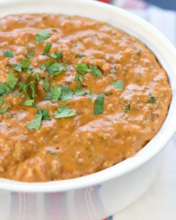 Hot Taco Dip ~ warm, creamy, and loaded with taco seasoned beef, cream cheese, cheddar, salsa, and cilantro for a popular party appetizer or football tailgating recipe! | FiveHeartHome.com