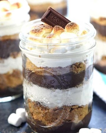 Mini S'mores Trifles ~ layered with rich chocolate pudding, crushed graham crackers, and marshmallow-laced whipped cream for a simple, yummy, no-bake dessert! | FiveHeartHome.com