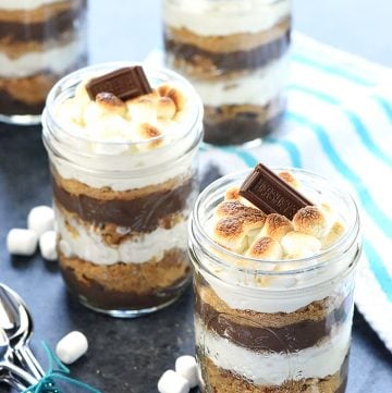 Mini S'mores Trifles ~ layered with rich chocolate pudding, crushed graham crackers, and marshmallow-laced whipped cream for a simple, yummy, no-bake dessert! | FiveHeartHome.com