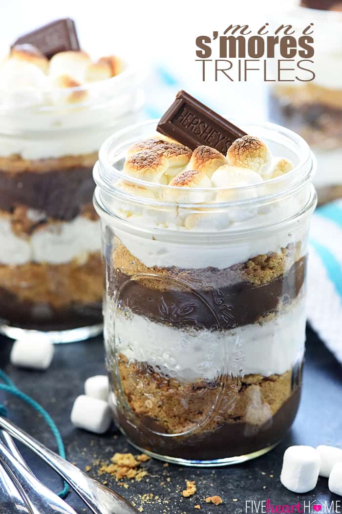 Mini S'mores Trifles ~ layered with rich chocolate pudding, crushed graham crackers, and marshmallow-laced whipped cream for a simple, yummy, no-bake dessert! | FiveHeartHome.com Mini S'mores Trifles with text overlay.