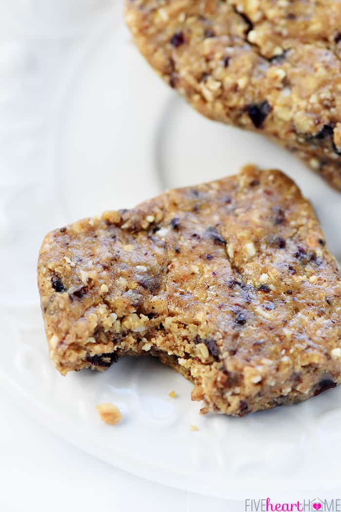 No-Bake Oatmeal Peanut Butter Energy Bars ~ these easy energy bars quickly come together in the food processor with wholesome ingredients like oats, nuts, chia seeds, peanut butter (or your favorite alternative), dried fruit, and honey! | FiveHeartHome.com Energy Bar recipe with missing bite.
