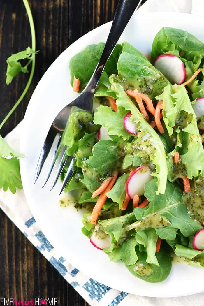 Bowl with lettuce, carrots, and radishes