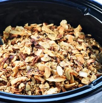 Slow Cooker Granola ~ a combination of oats, nuts, coconut, coconut oil, and honey effortlessly cook in the crock pot for a crunchy, wholesome breakfast or snack! | FiveHeartHome.com