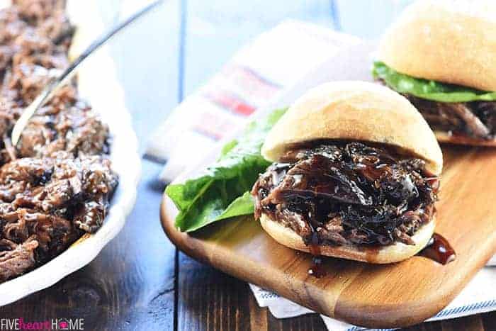 Slow Cooker Honey Balsamic Shredded Beef Sandwiches on wooden board.