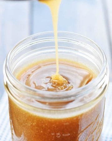 Caramel Sauce being poured into jar.