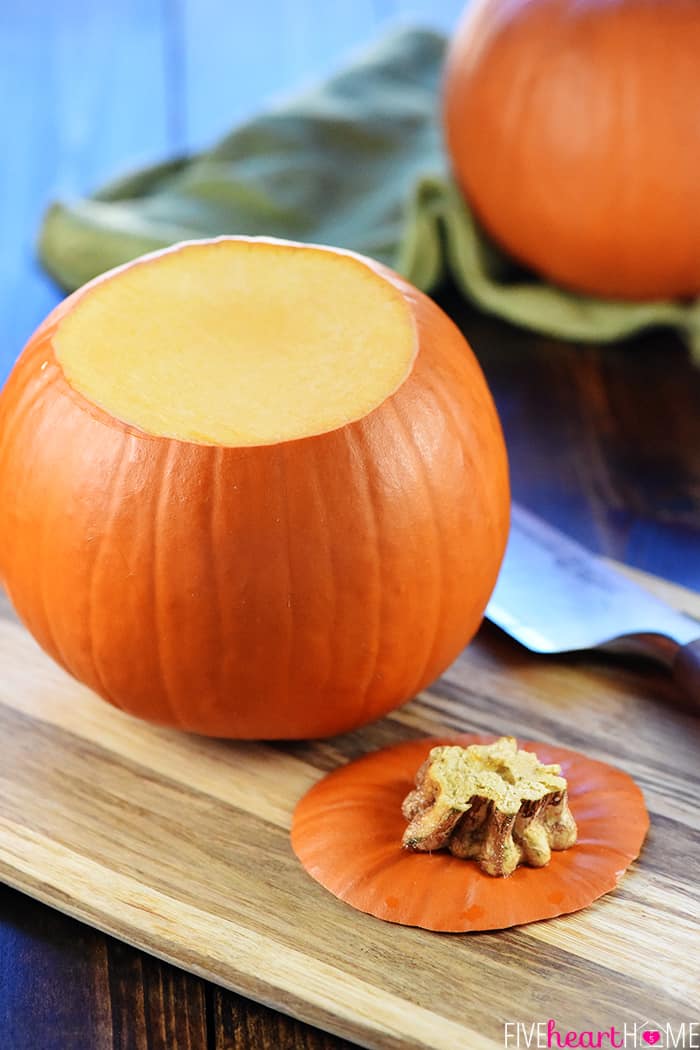 Sugar pumpkin with top sliced off.