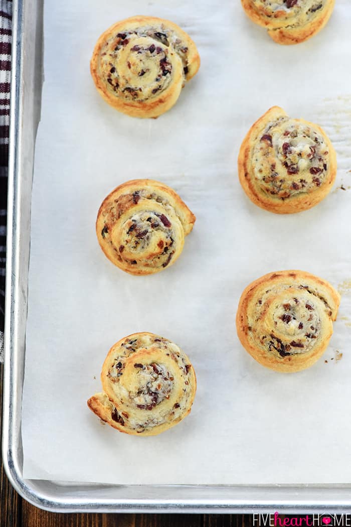 Aerial view of baking sheet filled of pinwheels.