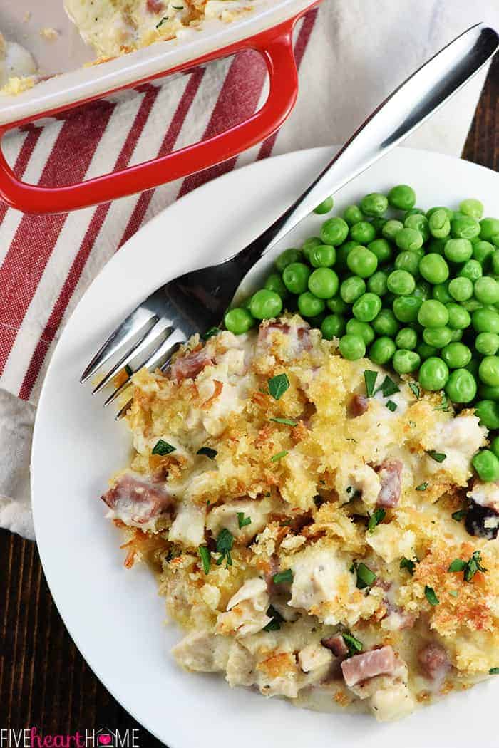 Close-Up of Turkey Cordon Bleu Served with Peas on White Plate 