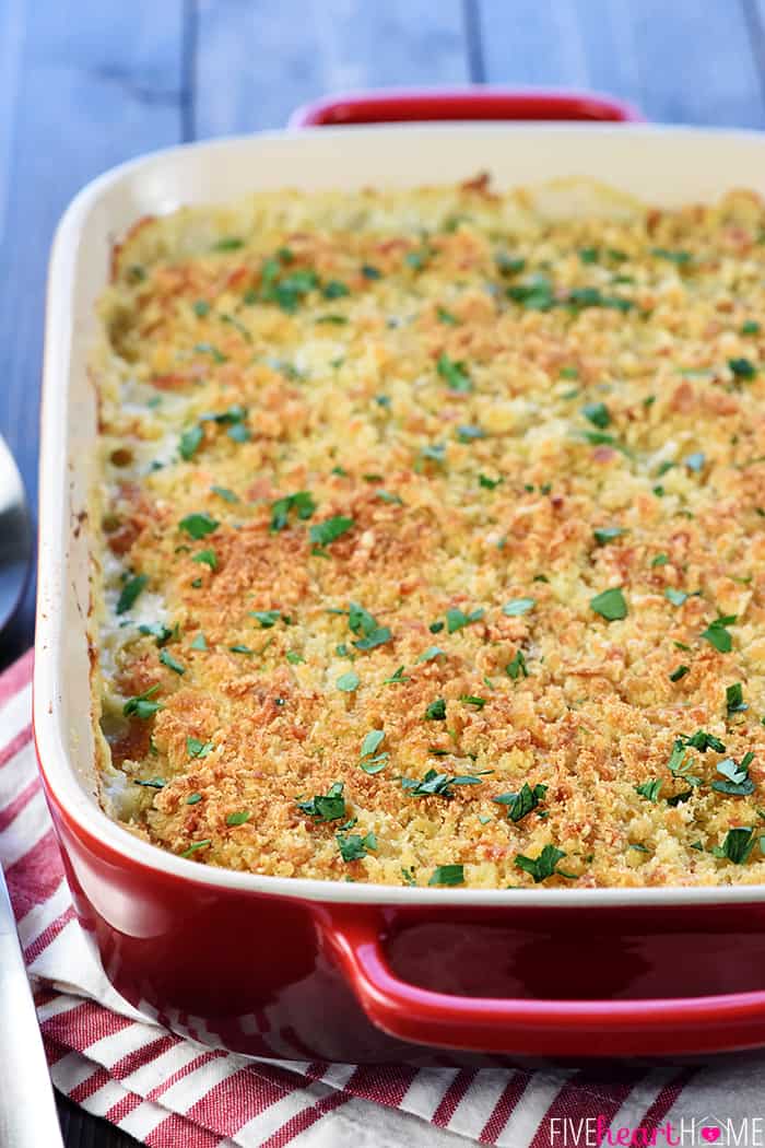 Chicken Cordon Bleu Casserole in Red Baking Dish on Red Striped Tea Towel 