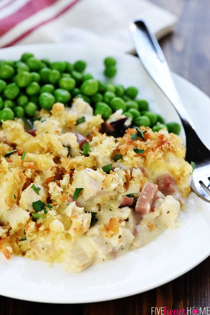 Thanksgiving Leftovers Casserole Served with Peas on a White Plate 