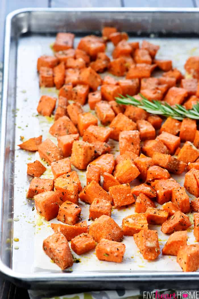 Roasted Savory Sweet Potatoes on baking sheet with rosemary.