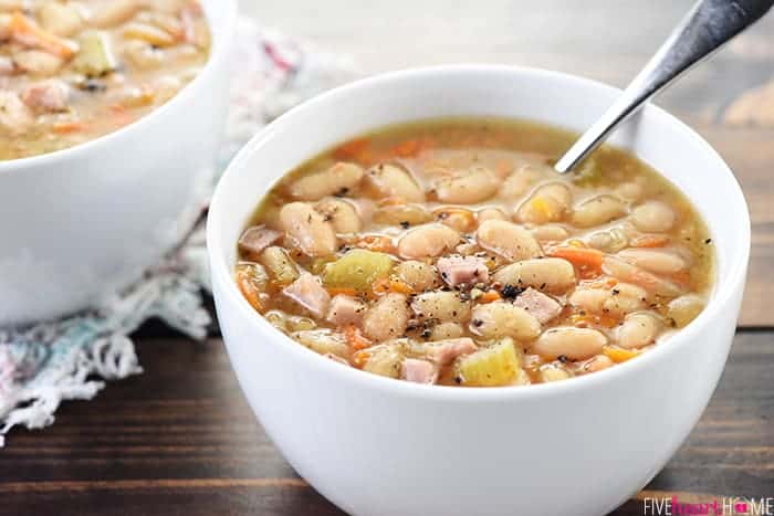 Bowls of Slow Cooker Ham and Bean Soup with spoon.