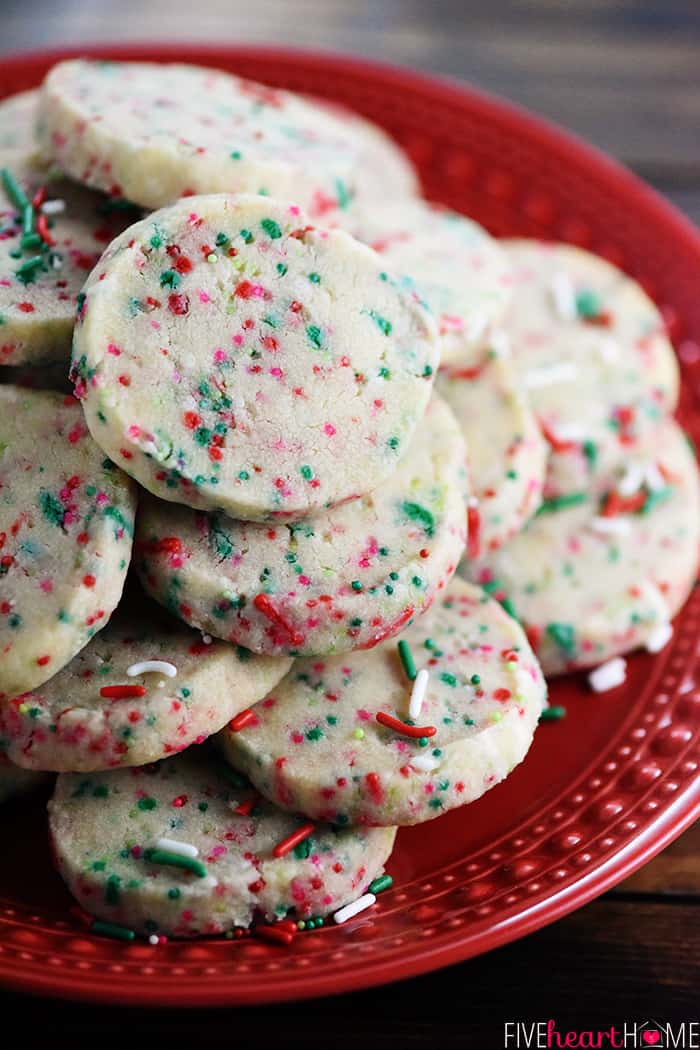 Pile of easy Christmas cookies on red plate.