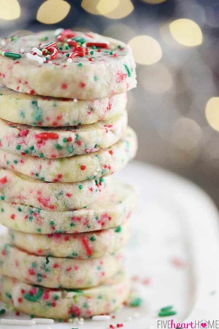 Stack of Christmas Shortbread Cookies with sprinkles.