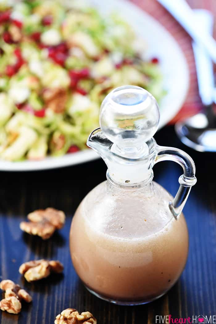 Glass bottle of homemade pomegranate vinaigrette.