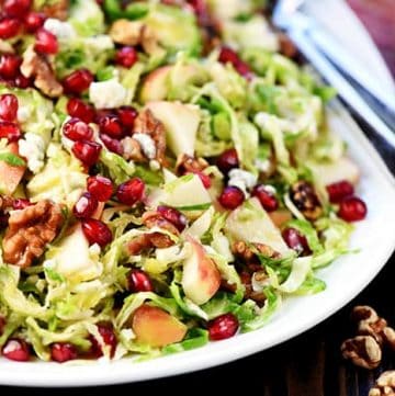 Holiday Brussels Sprouts Salad ~ loaded with fresh shaved Brussels sprouts, crisp apple, tangy-sweet pomegranate, toasty walnuts, and zippy blue cheese for a fresh, healthy, gorgeous salad that's perfect for any meal! | FiveHeartHome.com