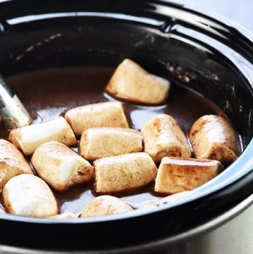 Slow Cooker Hot Chocolate ~ using a crock pot is the easiest way to make a big batch of rich, decadent hot cocoa for a crowd, and four flavor variations make it extra yummy: regular, salted caramel, peppermint, and Mexican hot chocolate! | FiveHeartHome.com