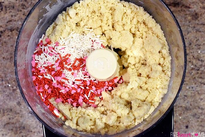 Dough in food processor with Valentine's sprinkles on top.