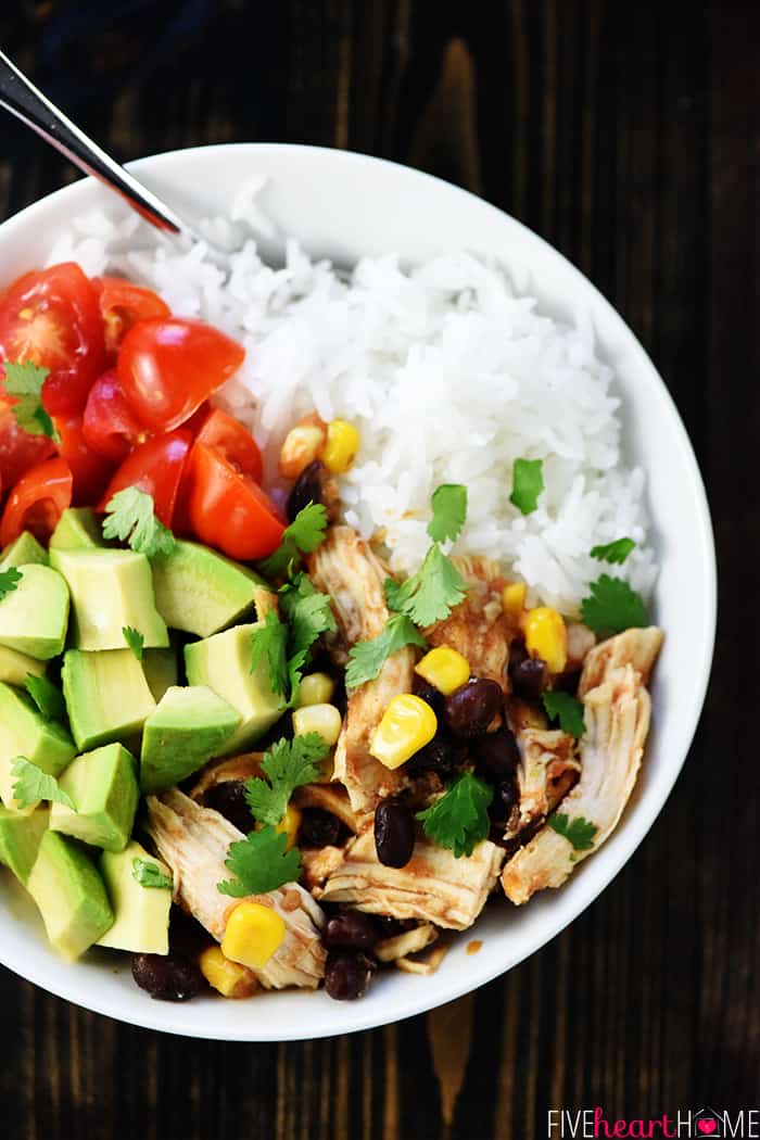 Instant Pot Chicken Tacos filling served with rice, avocado, and tomatoes.