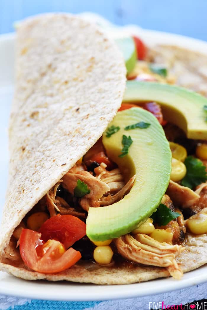 Instant Pot Chicken Taco on a plate with avocado slices.