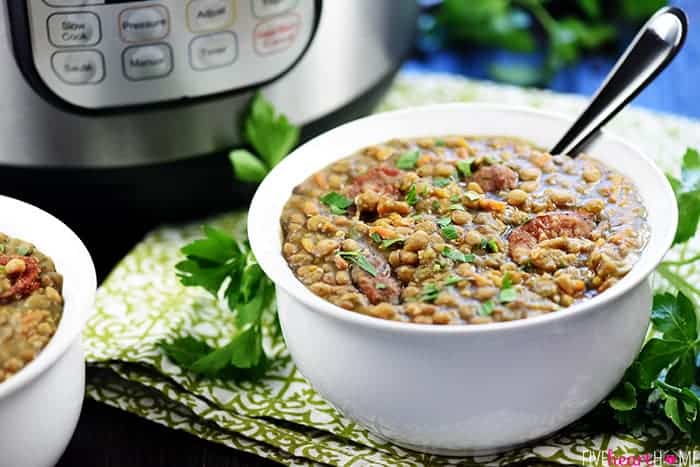 Bowl of German Lentil Soup in front of Instant Pot.