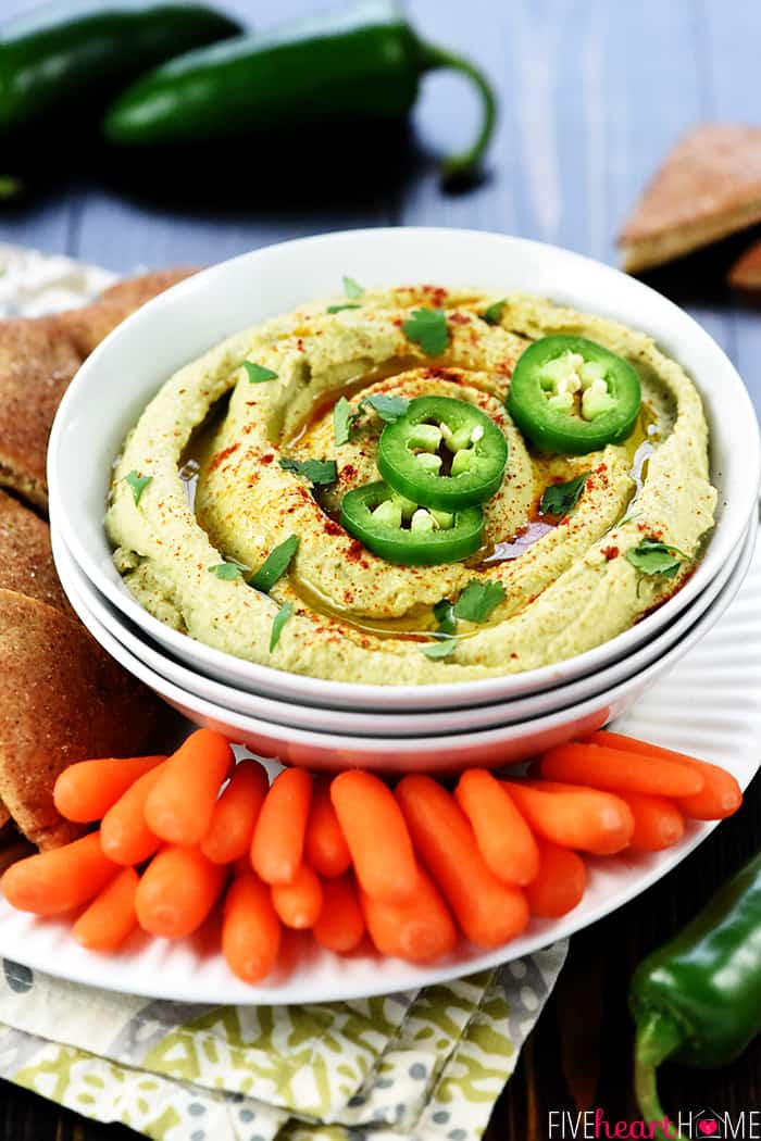 Jalapeño Hummus ~ classic hummus gets a zippy kick in this healthy, flavorful, quick and easy dip for pita wedges or your favorite raw veggies! | FiveHeartHome.com Served with Baby Carrots and Bread for Dipping