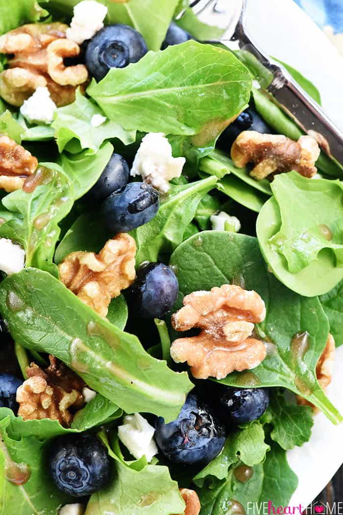 Brain Healthy Salad ~ loaded with leafy greens, blueberries, walnuts, and extra-virgin olive oil for an easy, tasty way to enjoy brain-protective foods in your diet! | FiveHeartHome.com Aerial view of spinach, blueberries, walnuts, and feta on plate.