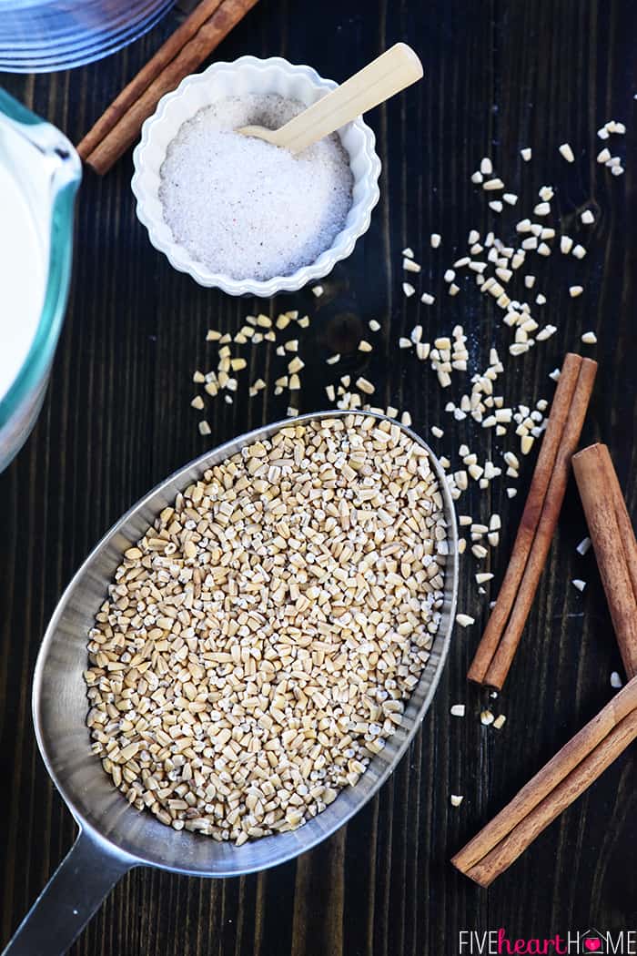 Aerial view of steel cut oats in measuring cup plus other ingredients.