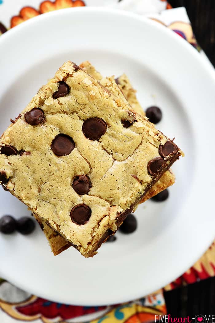 Aerial view of stack of blondies with chocolate chips.