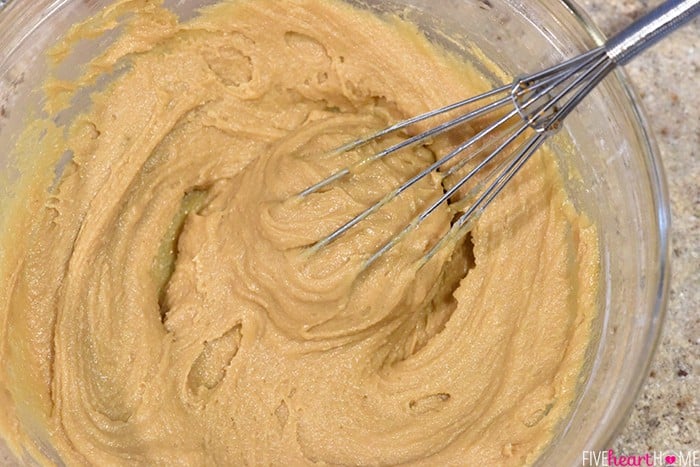 Whisking the batter in a glass bowl.