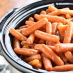 Crockpot carrots in slow cooker with a honey cinnamon glaze.