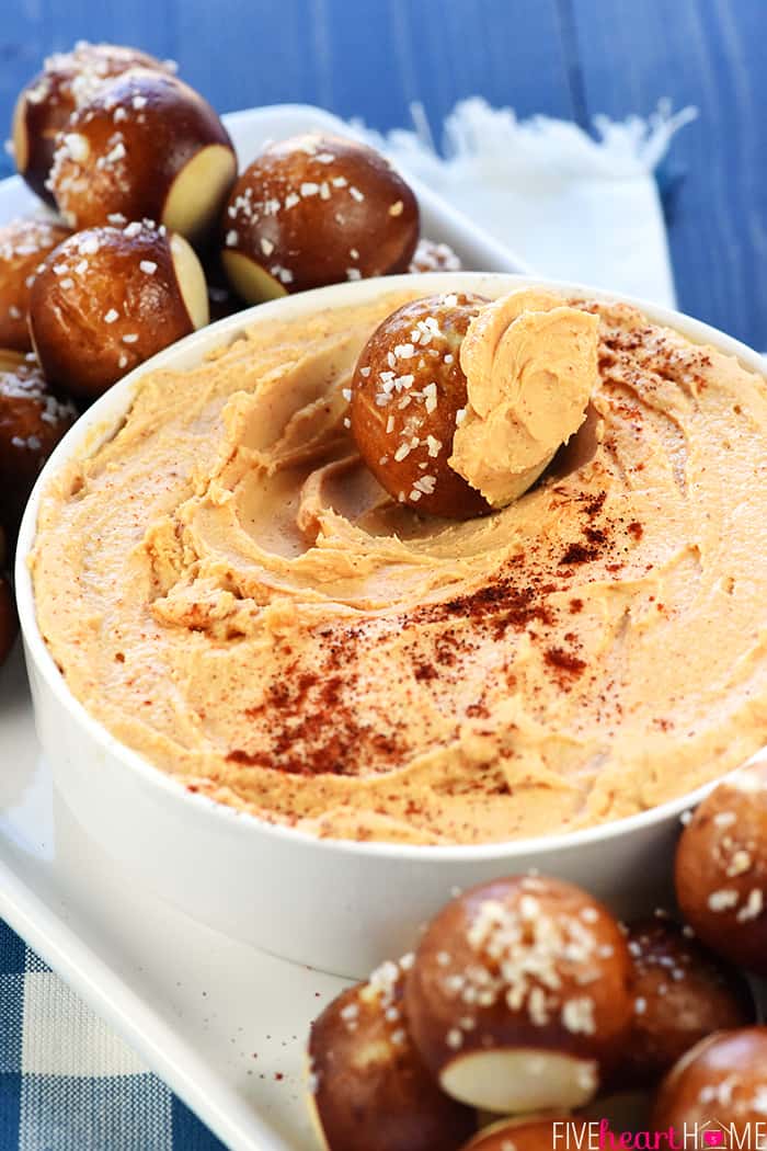 Zesty Cheese Spread ~ quick to make, delicious on pretzels, crackers, or raw veggies, and a perfect recipe for Super Bowl Sunday! | FiveHeartHome.com Close-up of Cheddar Cheese Spread in bowl with pretzels.