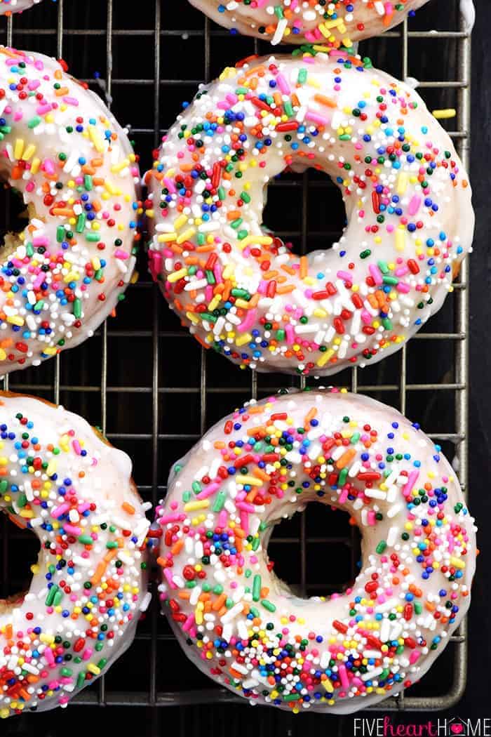 Aerial view of glazed Funfetti Donuts on cooling rack.