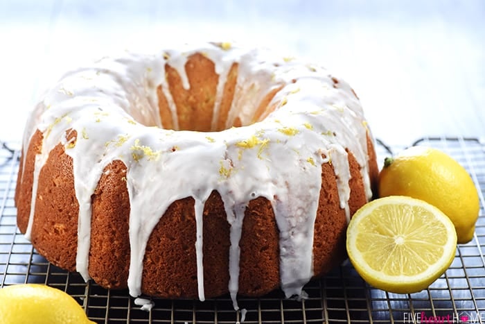 Recipe for Lemon Pound Cake on wire rack with lemons.