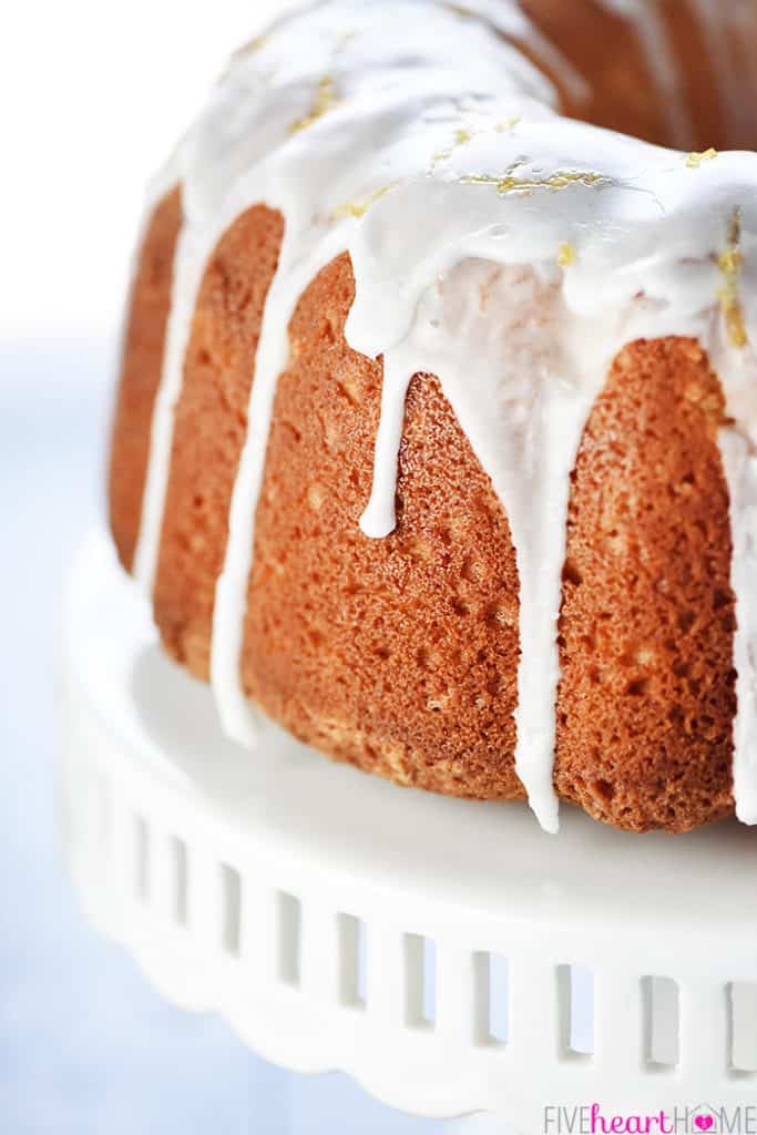 Close-up of the best Lemon Pound Cake with glaze on cake stand.