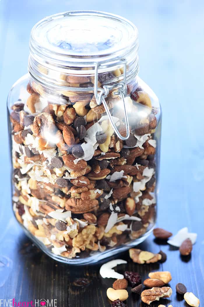 Large glass jar full of Trail Mix.