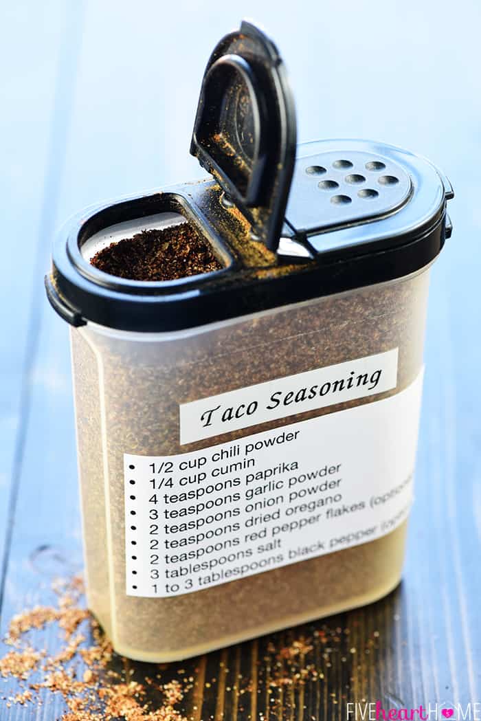 Homemade Taco Seasoning ~ you control the ingredients in this economical, easy-to-make homemade seasoning mix recipe...perfect for your favorite tacos or Mexican food recipes! | FiveHeartHome.com Taco Seasoning in a spice shaker with label of ingredients.